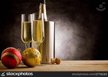 Champagner Glasses on wooden table with christmas ornaments