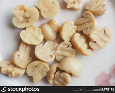 Champignon mushroom dish. Agaricus bisporus aka champignons mushrooms in a dish sliced in half