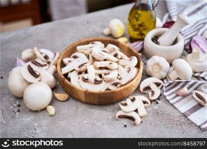 champignon mushrooms in wooden bowl at domestic kitchen.. champignon mushrooms in wooden bowl at domestic kitchen