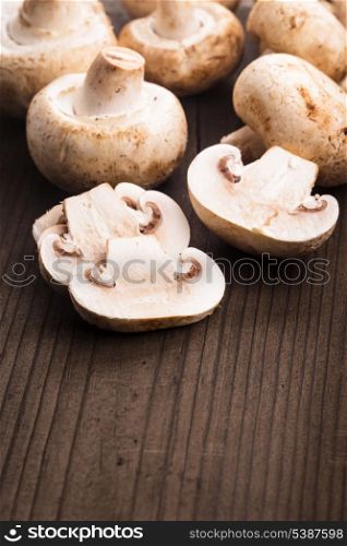 Champignons and slices on the wooden table closeup