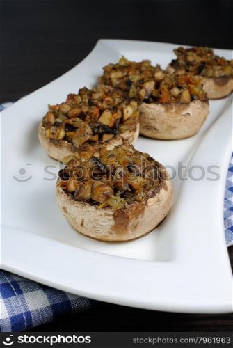 champignons with vegetable stuffing on a platter