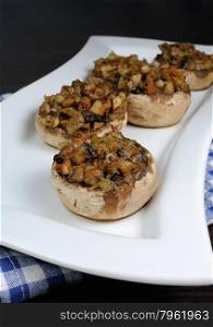 champignons with vegetable stuffing on a platter