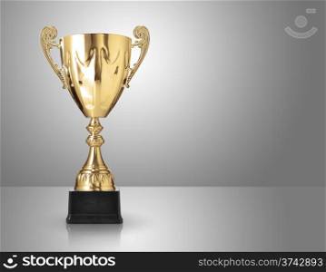 champion golden trophy over grey background