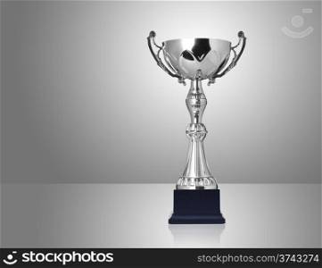 champion silver trophy on grey background