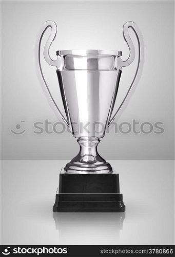 champion silver trophy over grey background