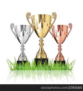 Champion trophies green on grass. Isolated on white