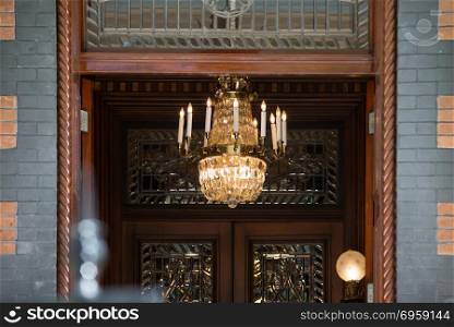 chandelier visible through building entrance