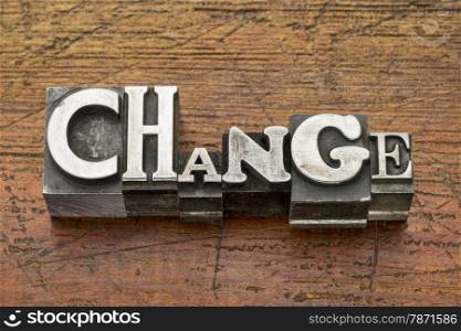 change word in mixed vintage metal type printing blocks over grunge wood