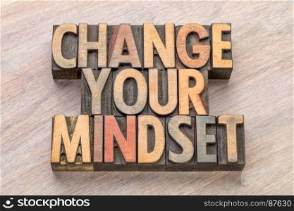 change your mindset - motivational text in vintage letterpress wood type printing blocks stained by color inks