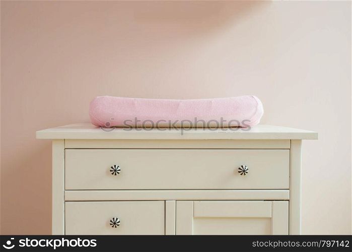 Changing mat in baby room modern design, pink colors cute. Changing mat in baby room modern design, pink colors