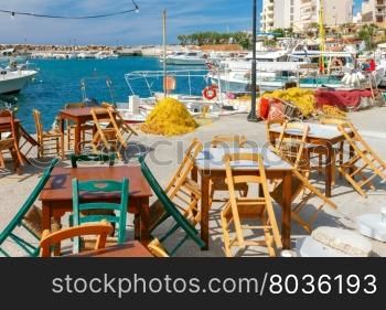 Chania. Cafe on the beach.. Street cafe on the waterfront of the venetian harbor in Chania. Crete. Greece.