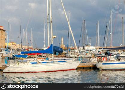 Chania. Fishing boats and yachts in the harbor.. Boats and sailboats in the old Venetian harbor of Chania. Greece. Crete.
