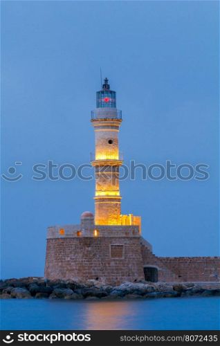 Chania. Old harbor at night.. Old stone lighthouse in the Venetian harbor of Chania. Greece. Crete.