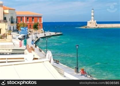 Chania. The old Venetian harbor.. View of the quay with lanterns and old lighthouse in the Venetian harbor. Crete. Greece.