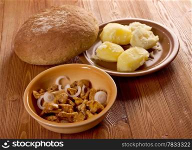 Chanterelle pickled and potato,farmhouse bread .farm-style .close up