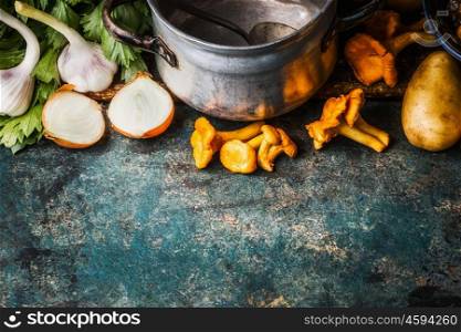 Chanterelles ingredients and old cooking pot on rustic background, top view, border