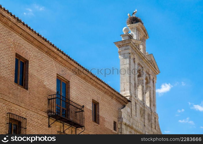 Chapel of San Ildefonso in Alcala de Henares, with storks on the tower, Madrid province, Spain