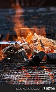 charcoal fire grill, close up with live flames