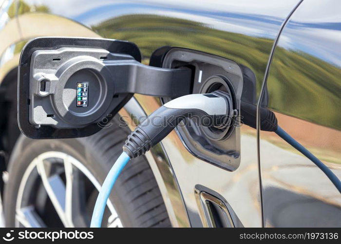 Charging battery of an electric car at charge station