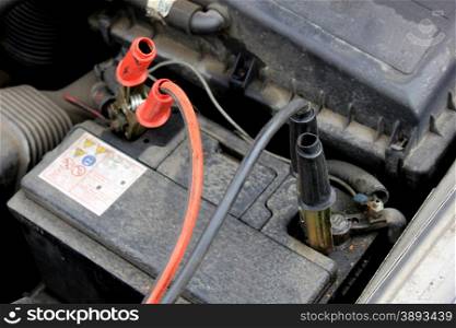 Charging the battery of an old car, using battery cables