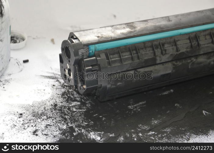 Charging the laser printer cartridge with toner the powder