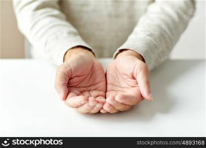 charity, donation, poverty and people concept - close up of empty senior man hands