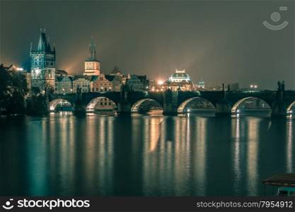 Charles Bridge and Old Town at night in Prague, Czech Republic. Toning in cool tones