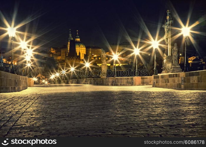 Charles bridge in Prague with lanterns at night