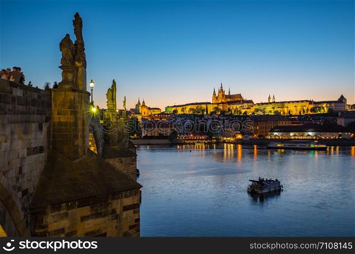 Charles Bridge with Prague city skyline at night in Prague, Czech Republic.