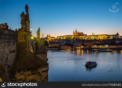 Charles Bridge with Prague city skyline at night in Prague, Czech Republic.