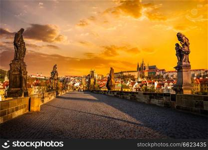 Charles bridge with statues and Prague castle on surise. Prague, Czech Republic. Charles bridge and Prague castleon sunrise