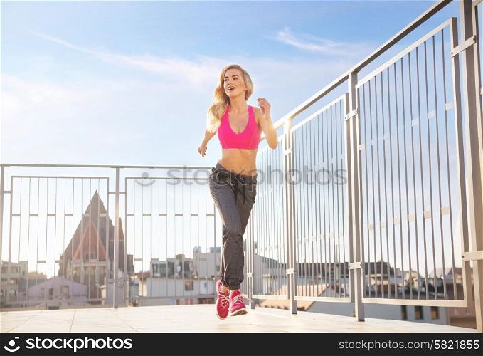 Charming, athletic lady running on the roof
