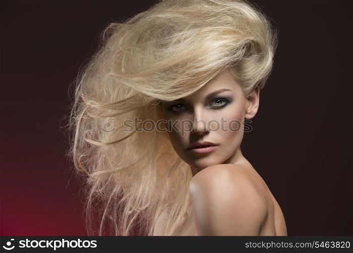 charming beauty portrait of very sexy woman with naked shoulders, bushy creative blonde hair-style and cute make-up