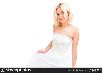 charming blonde in a white wedding dress in the studio