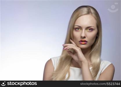 charming blonde woman with spring style, multicolor make-up, long straight hair and white dress