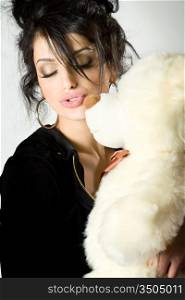 charming brunette posing with teddy bear
