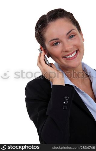 charming businesswoman talking on her cell phone