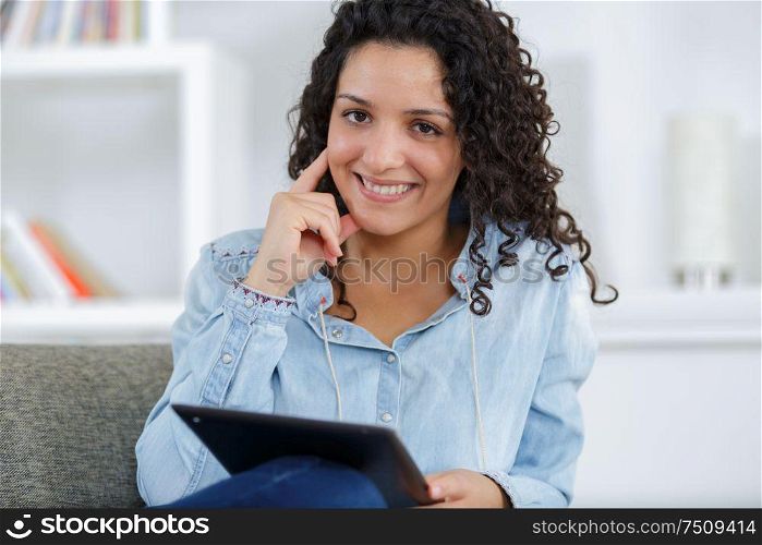 charming confident trendy woman using a tablet