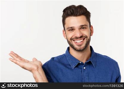 Charming handsome. Handsome young man in casual wear while standing isolated on white background.. Charming handsome. Handsome young man in casual wear while standing isolated on white background