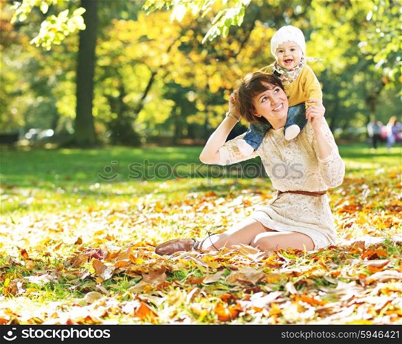 Charming mother playing with her cute baby