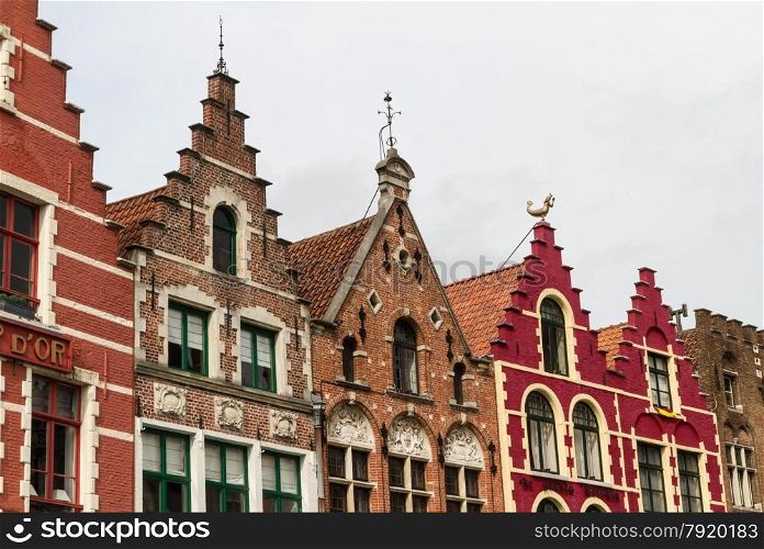 Charming old gables of Belgian houses. Market Square, Bruges, West Flanders, Belgium, Europe.