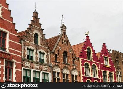 Charming old gables of Belgian houses. Market Square, Bruges, West Flanders, Belgium, Europe.