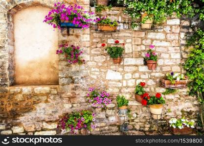 Charming old medieval villages of Italy with typical floral narrow streets. Spello , Umbria. typical floral streets of Italian villages, Spello