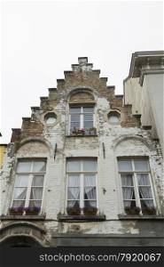 Charming old town house, looking up at gable end. Bruges, West Flanders, Belgium, Europe