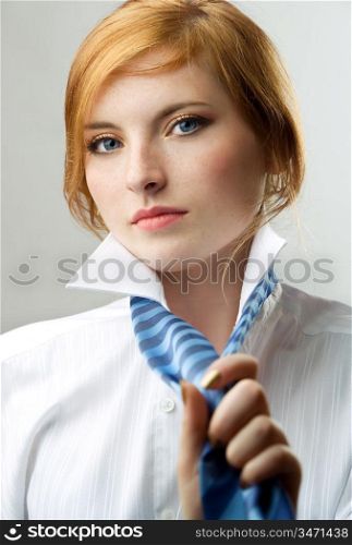charming readhead in white shirt with blue tie