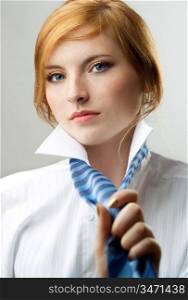 charming readhead in white shirt with blue tie