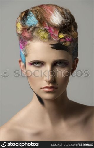charming sexy woman in close-up portrait with colorful hair-style and bizarre make-up. artistic painted style