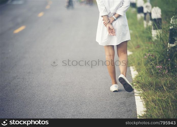 Charming Woman Walking on the road
