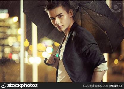 Charming young model with black umbrella