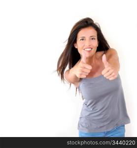 Charming young woman showing thumbs up, isolated